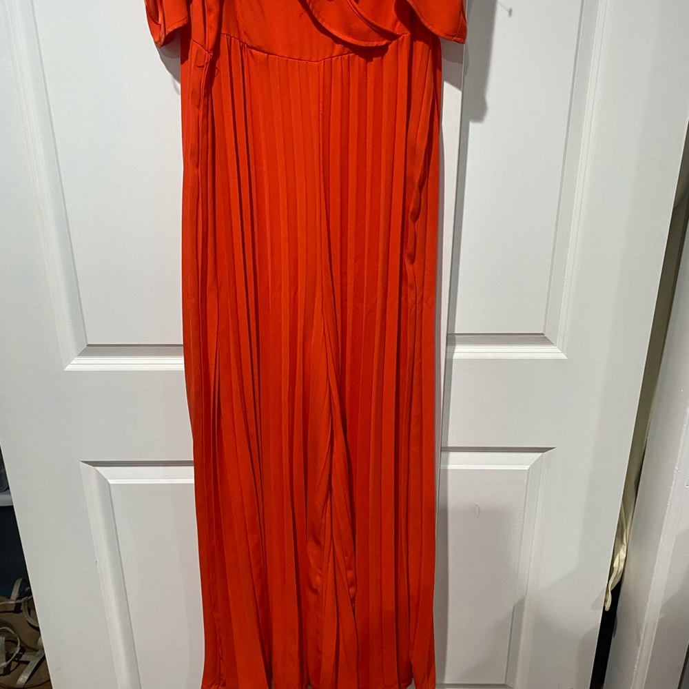 Fashion Nova Vibrant Orange wide leg pleated jumpsuit.